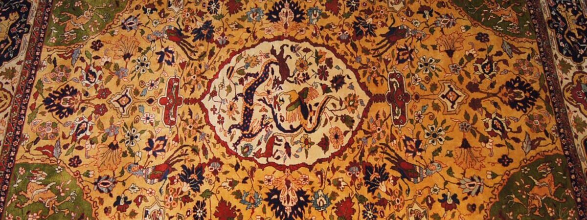 ペルシャ絨毯のデザインや技術にはどのような文化の影響があるのか？