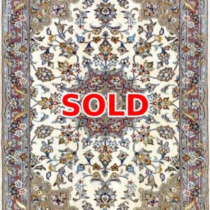 Cream-colored oriental rug with blue, red, and gold floral pattern; large red SOLD text over the center indicating sold status